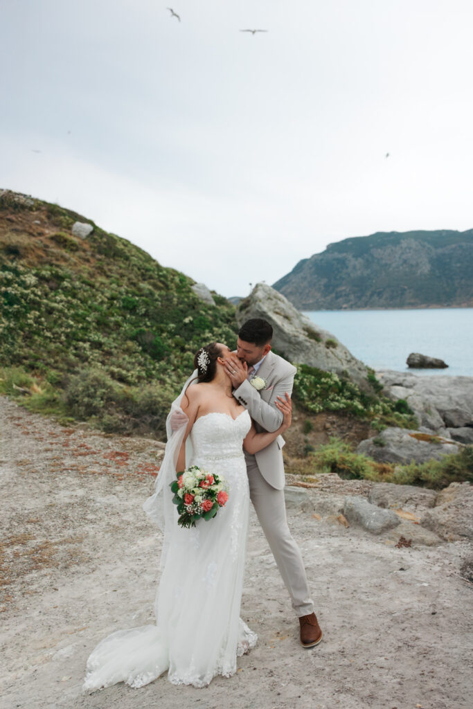 Outdoors island wedding ceremony, editorial photography, destination wedding at Agios Stephanos, Kastri island in KOS, Greece. Couple portraits at the island hills, with some green and ocean views.