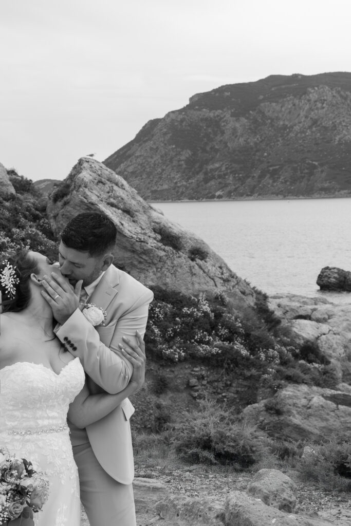 Outdoors island wedding ceremony, editorial photography, destination wedding at Agios Stephanos, Kastri island in KOS, Greece. Couple portraits at the island hills, with some green and ocean views.