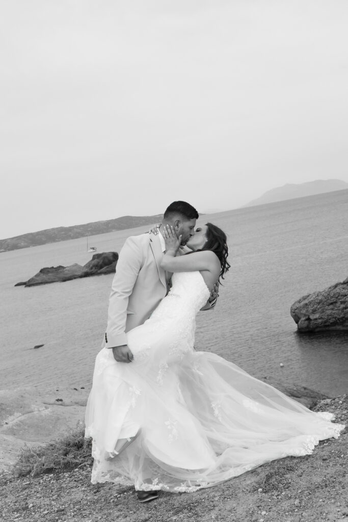 Outdoors island wedding ceremony, editorial photography, destination wedding at Agios Stephanos, Kastri island in KOS, Greece. Couple portraits at the island hills, with some green and ocean views.