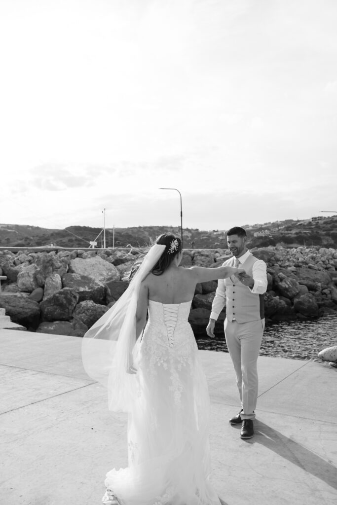 Outdoors island wedding ceremony, editorial photography, destination wedding at Agios Stephanos, Kastri island in KOS, Greece. Bride and groom couple photos by the pier.