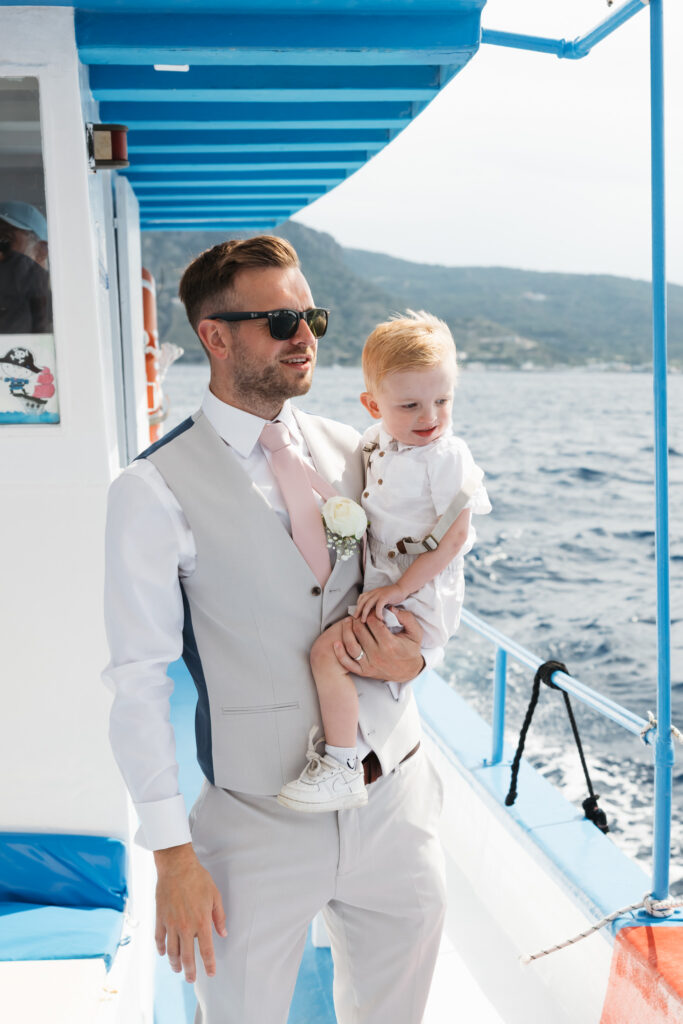 Wedding guests arriving by boat for outdoors island wedding ceremony, editorial photography, destination wedding at Agios Stephanos, Kastri island in KOS, Greece.