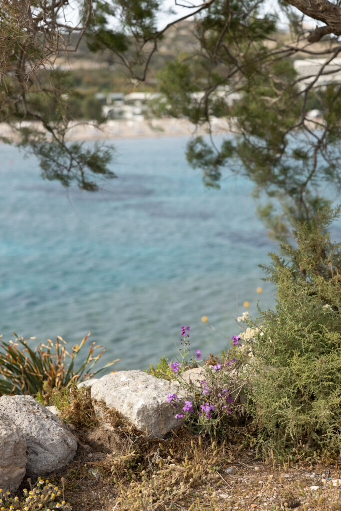 Outdoors island wedding ceremony, editorial photography, destination wedding at Agios Stephanos, Kastri island in KOS, Greece. Ocean view from the island.