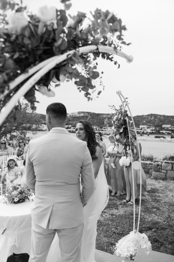 Outdoors island wedding ceremony, editorial photography, destination wedding at Agios Stephanos, Kastri island in KOS, Greece.