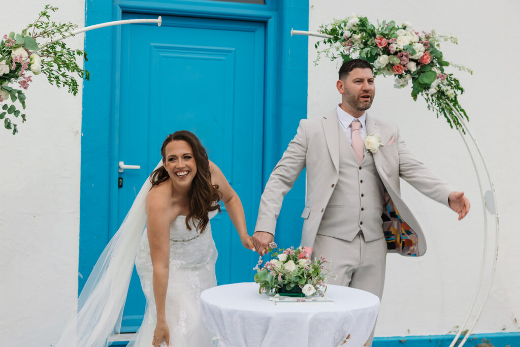 Outdoors island wedding ceremony, editorial photography, destination wedding at Agios Stephanos, Kastri island in KOS, Greece. Candid.