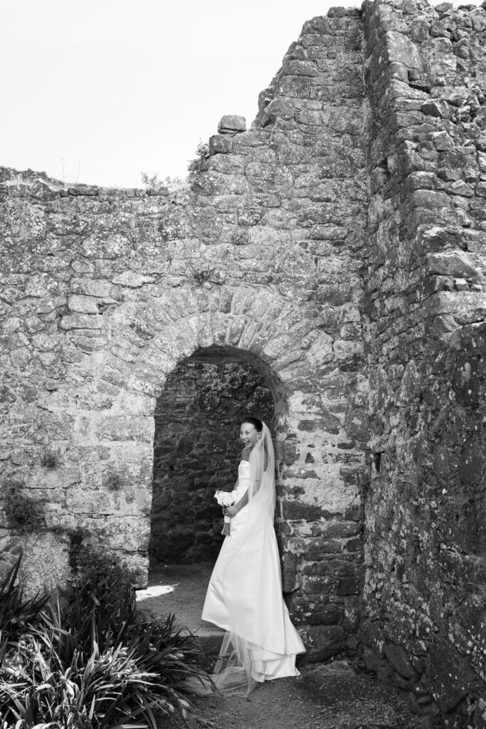 editorial wedding photographer at Gorey castle month Orgueil castle jersey Channel Islands, church ceremony, storytelling, candid, documentary, editorial, couple portraits