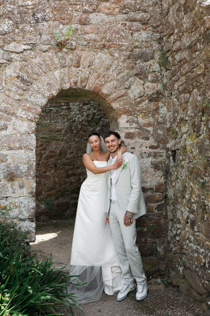 editorial wedding photographer at Gorey castle month Orgueil castle jersey Channel Islands, editorial couple portraits, asian bride from Hong Kong, British groom