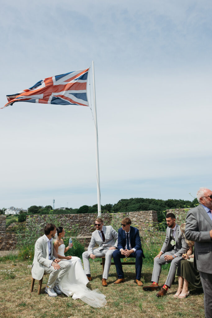 editorial wedding photographer at Gorey castle month Orgueil castle jersey Channel Islands, welcome drinks and cocktail hour