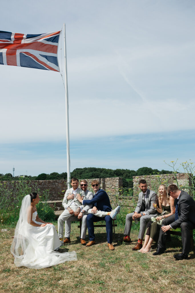 editorial wedding photographer at Gorey castle month Orgueil castle jersey Channel Islands, welcome drinks and cocktail hour