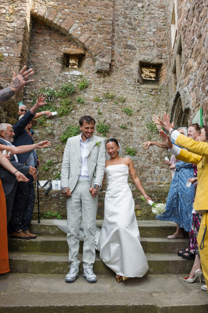 editorial wedding photographer at Gorey castle month Orgueil castle jersey Channel Islands, wedding breakfast detail shots, confetti shots, asian bride