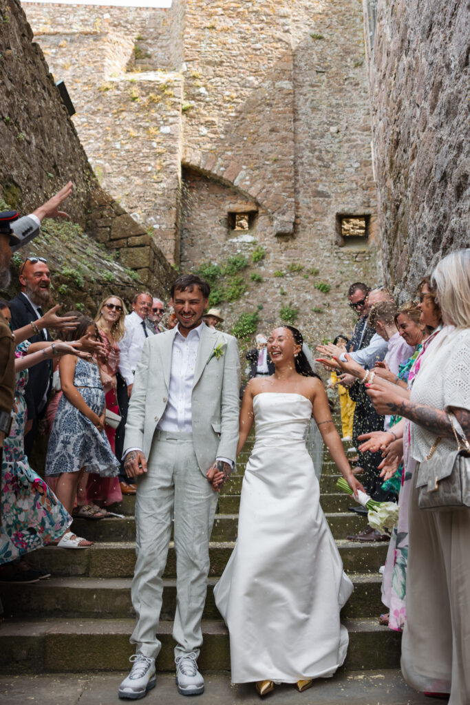 editorial wedding photographer at Gorey castle month Orgueil castle jersey Channel Islands, wedding breakfast detail shots, confetti shots, asian bride