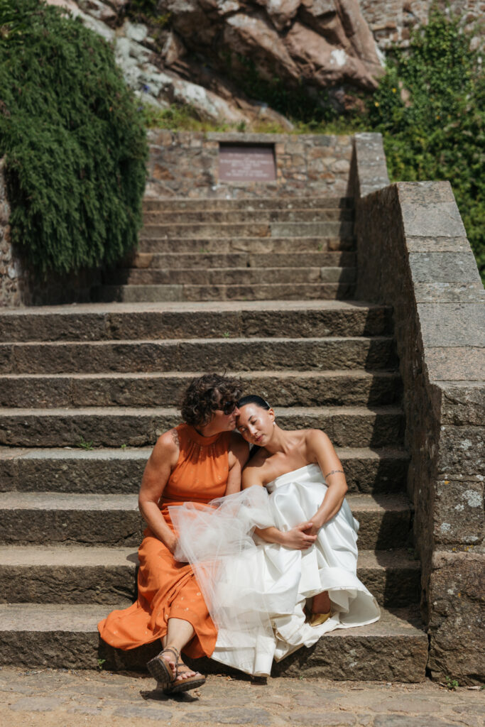 editorial wedding photographer at Gorey castle month Orgueil castle jersey Channel Islands, candid photos with mum, asian bride