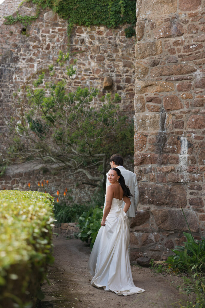 editorial wedding photographer at Gorey castle month Orgueil castle jersey Channel Islands, editorial couple portraits, asian bride from Hong Kong, British groom