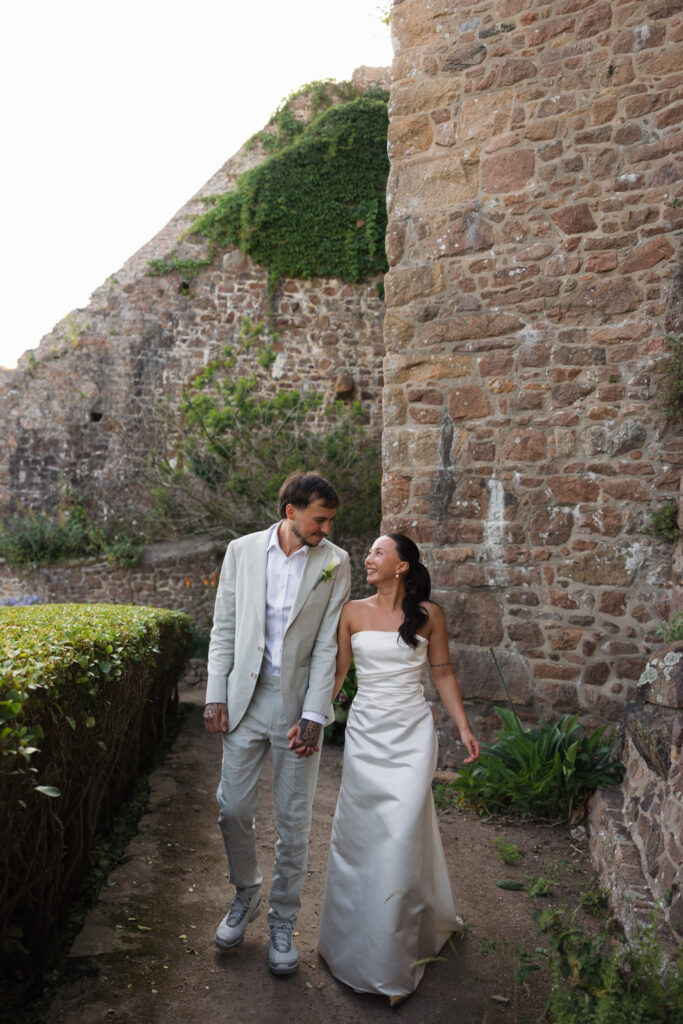 editorial wedding photographer at Gorey castle month Orgueil castle jersey Channel Islands, editorial couple portraits, asian bride from Hong Kong, British groom
