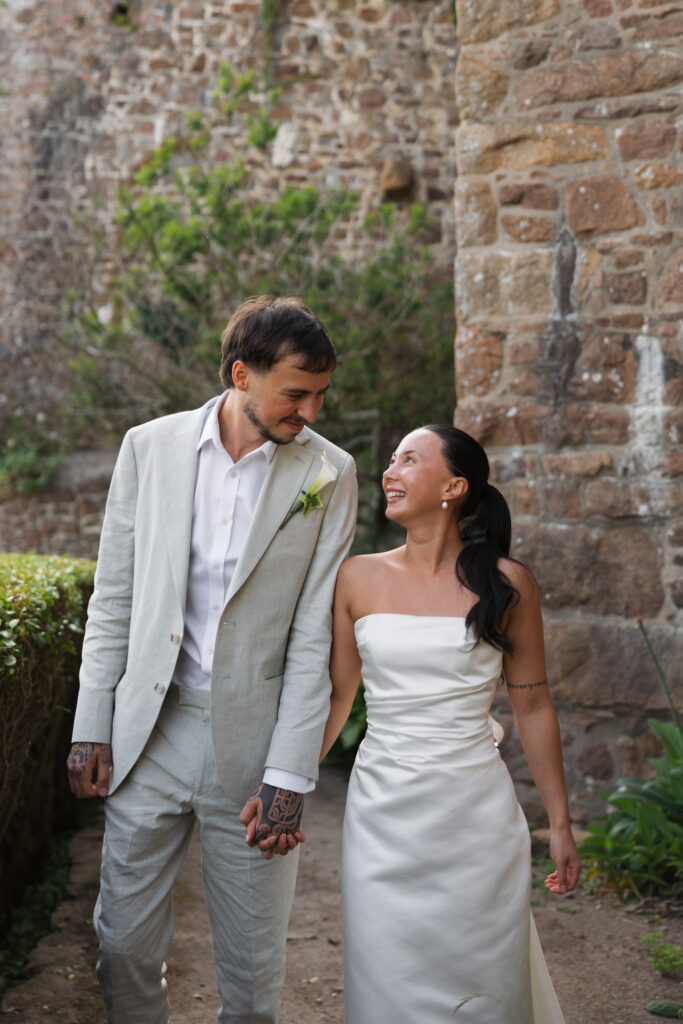 editorial wedding photographer at Gorey castle month Orgueil castle jersey Channel Islands, editorial couple portraits, asian bride from Hong Kong, British groom