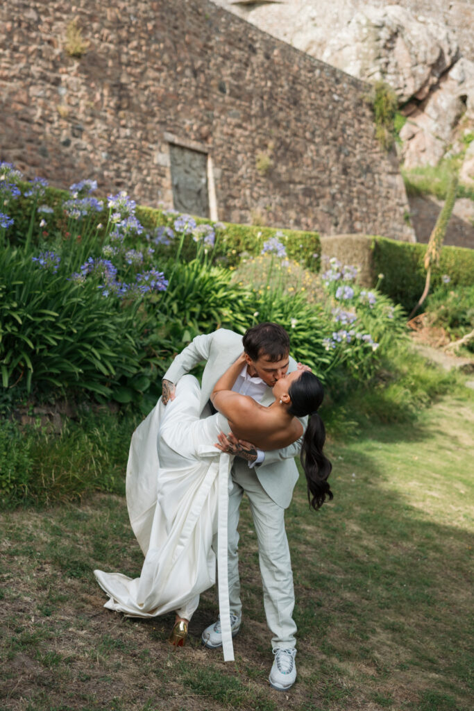 editorial wedding photographer at Gorey castle month Orgueil castle jersey Channel Islands, editorial couple portraits, asian bride from Hong Kong, British groom