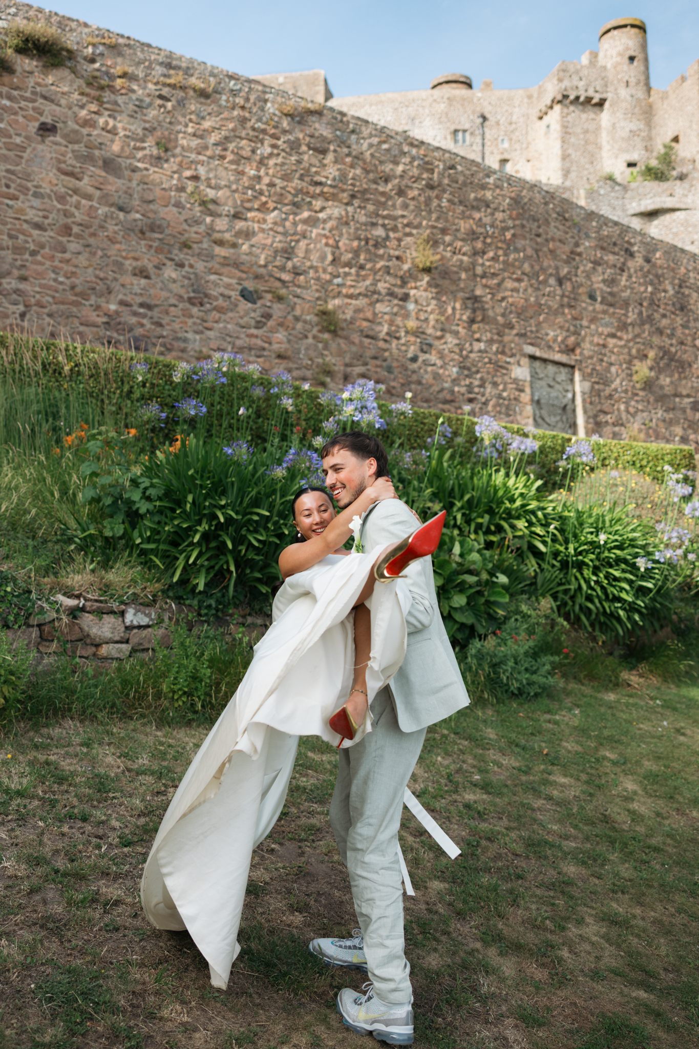editorial wedding photographer at Gorey castle month Orgueil castle jersey Channel Islands, editorial couple portraits, asian bride from Hong Kong, British groom