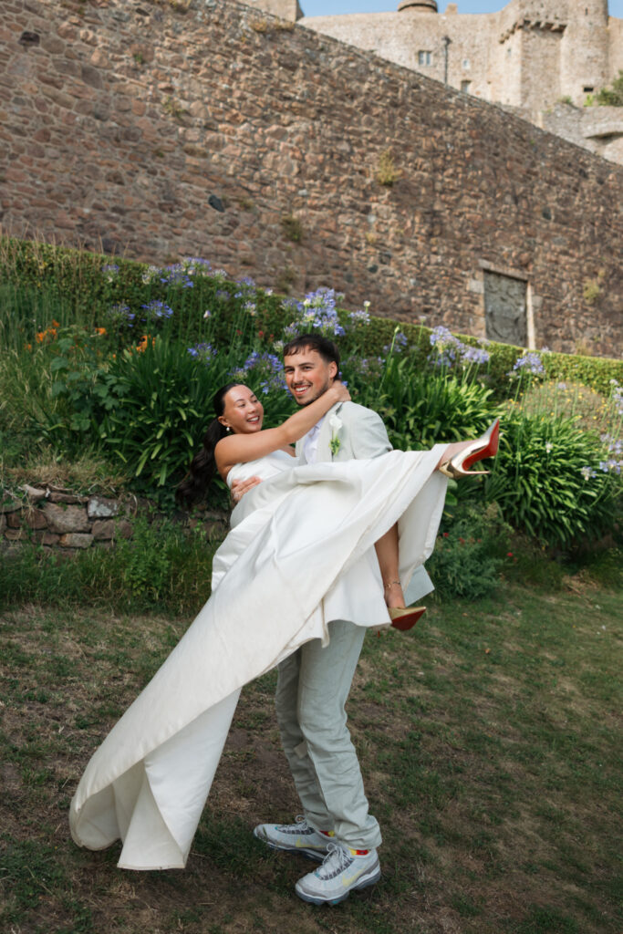 editorial wedding photographer at Gorey castle month Orgueil castle jersey Channel Islands, editorial couple portraits, asian bride from Hong Kong, British groom