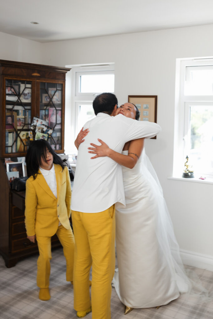 editorial flash bridal prep, asian bride dark hair, editorial wedding photos at Gorey castle month Orgueil castle jersey Channel Islands First look with dad