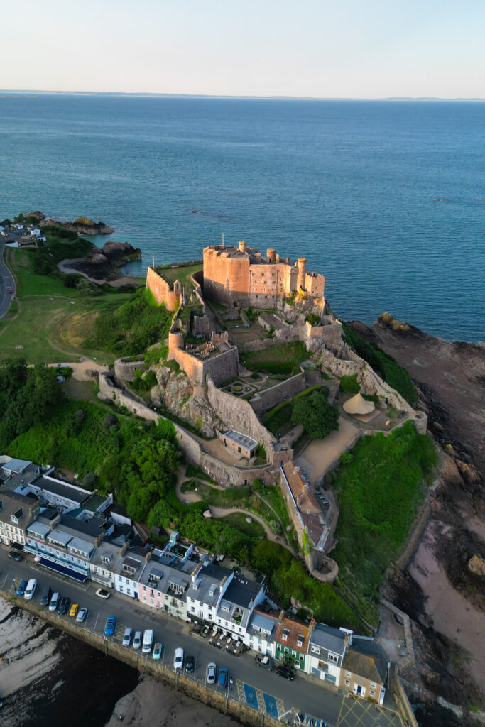 editorial flash bridal prep, asian bride dark hair, editorial wedding photos at Gorey castle month Orgueil castle jersey Channel Islands, drone photos