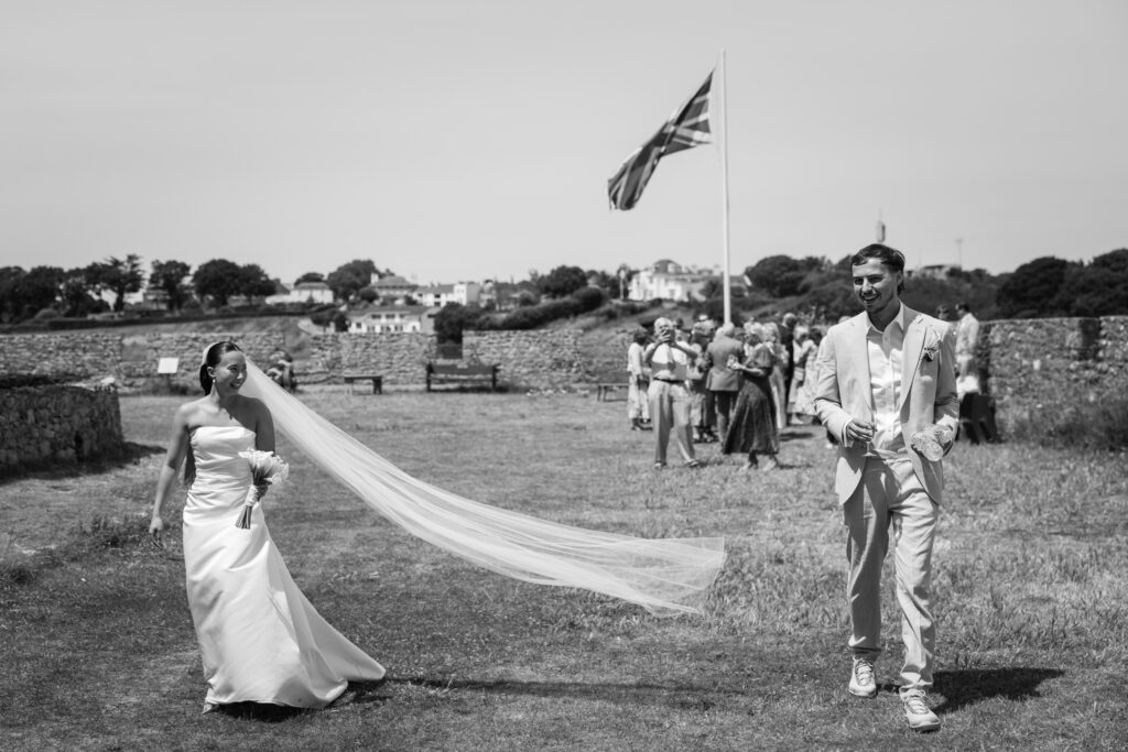 editorial wedding photographer at Gorey castle month Orgueil castle jersey Channel Islands, welcome drinks and cocktail hour
