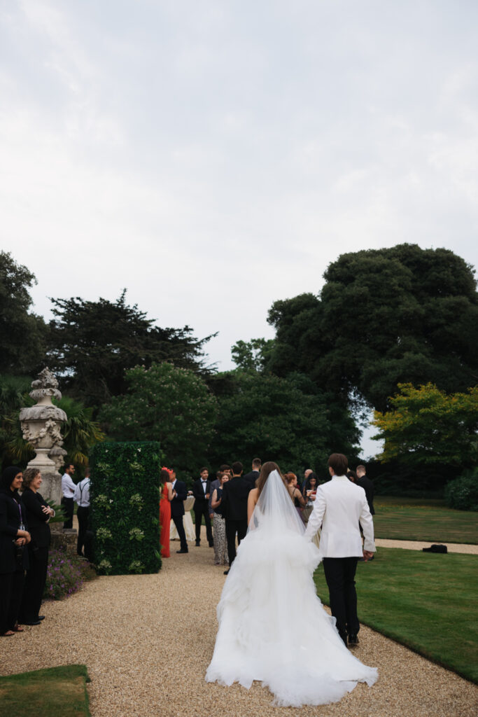 Editorial wedding photography of a young Gen Z fashion forward couple during their Russian luxury wedding at Syon Park Conservatory, London.