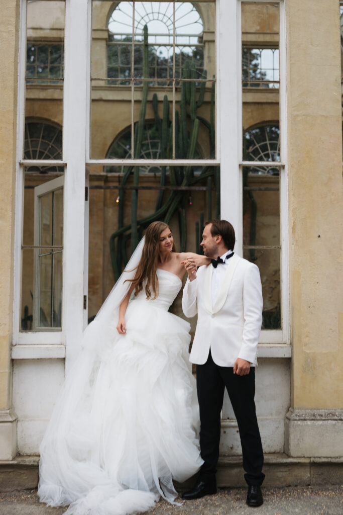 Editorial wedding photography of a young Gen Z fashion forward couple during their Russian luxury wedding at Syon Park Conservatory, London.