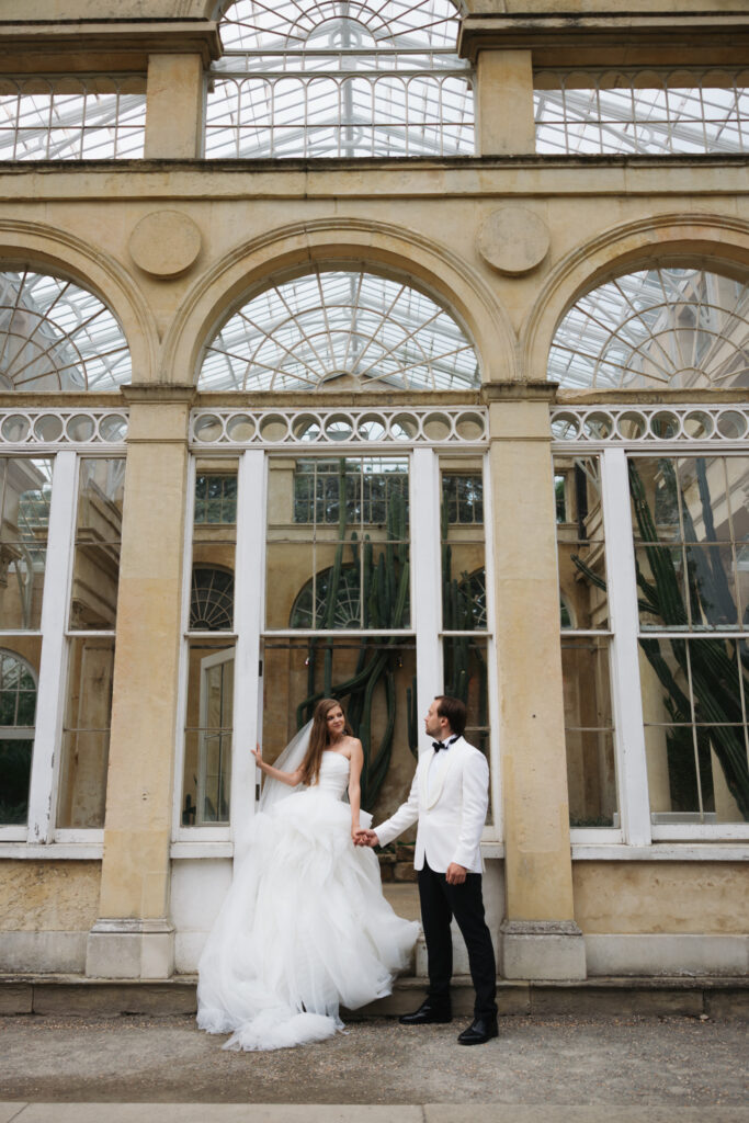 Editorial wedding photography of a young Gen Z fashion forward couple during their Russian luxury wedding at Syon Park Conservatory, London.
