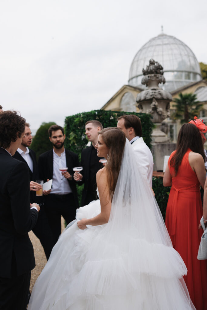 Editorial wedding photography of a young Gen Z fashion forward couple during their Russian luxury wedding at Syon Park Conservatory, London.