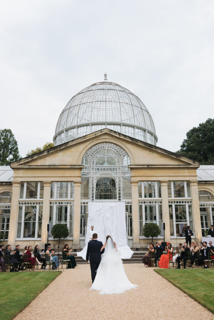 Editorial wedding photography of a young Gen Z fashion forward couple during their Russian luxury wedding at Syon Conservatory, London.