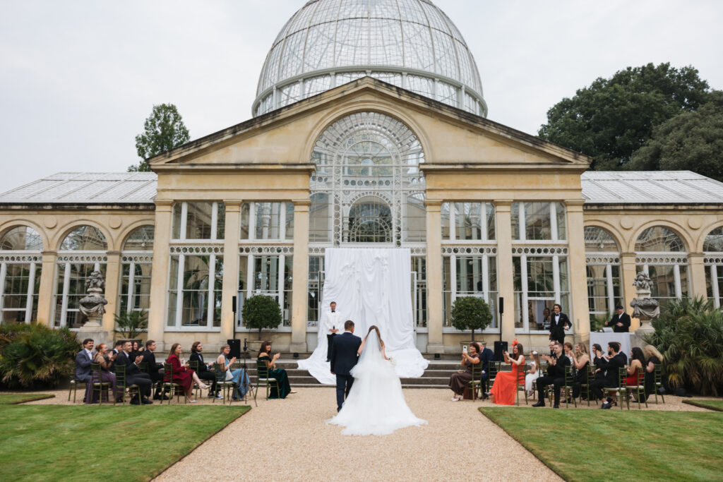 Editorial wedding photography of a young Gen Z fashion forward couple during their Russian luxury wedding at Syon Conservatory, London.