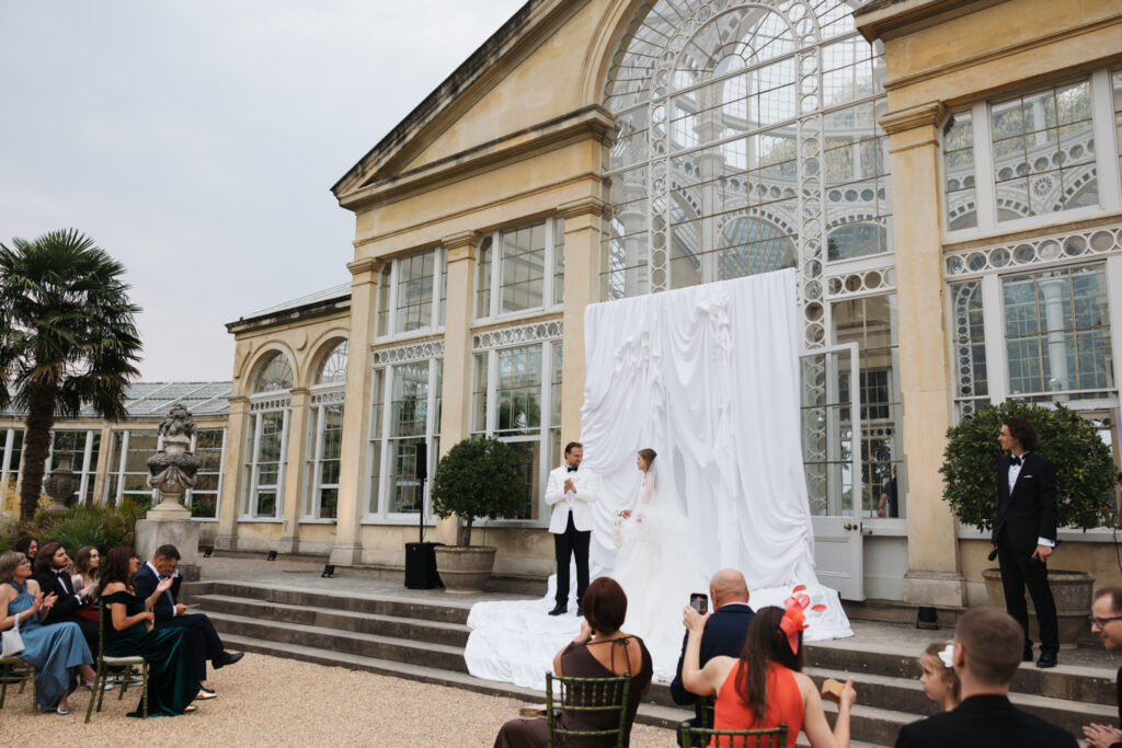 Editorial wedding photography of a young Gen Z fashion forward couple during their Russian luxury wedding at Syon Conservatory, London.