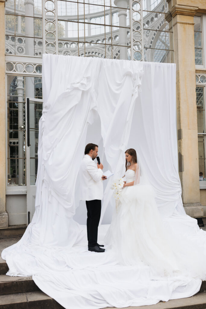 Editorial wedding photography of a young Gen Z fashion forward couple during their Russian luxury wedding at Syon Conservatory, London.