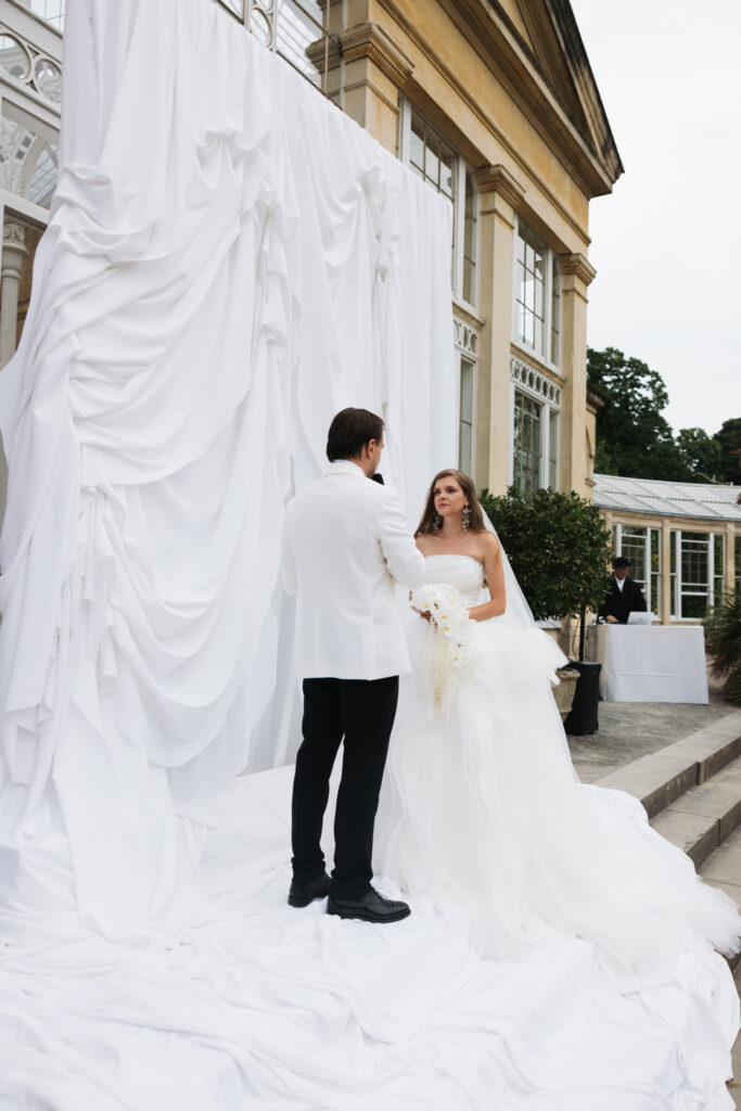 Editorial wedding photography of a young Gen Z fashion forward couple during their Russian luxury wedding at Syon Conservatory, London.