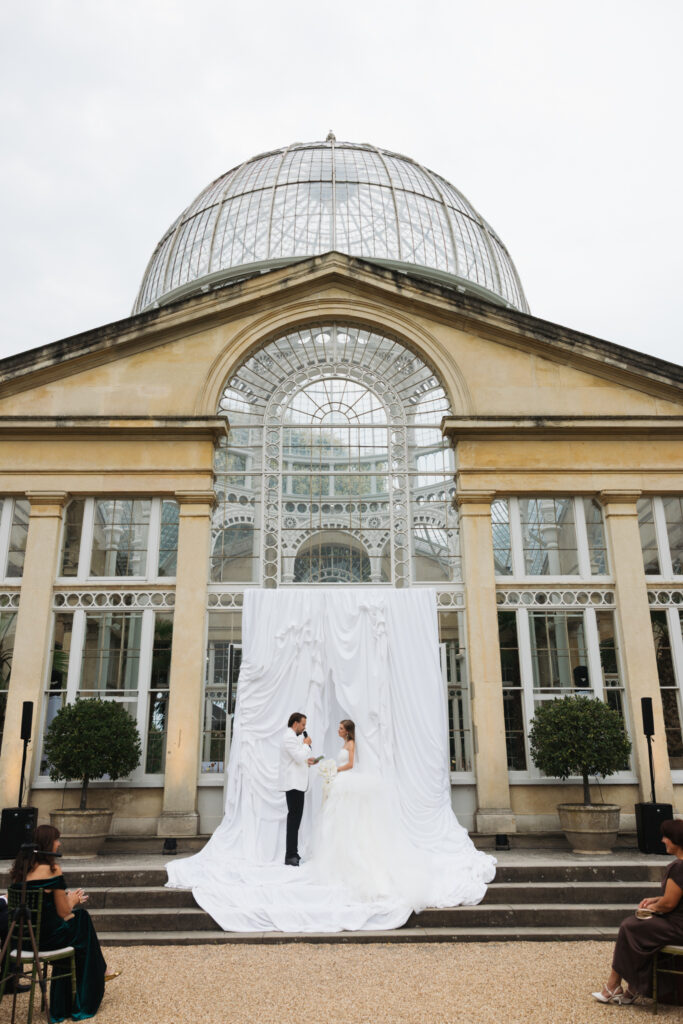 Editorial wedding photography of a young Gen Z fashion forward couple during their Russian luxury wedding at Syon Conservatory, London.