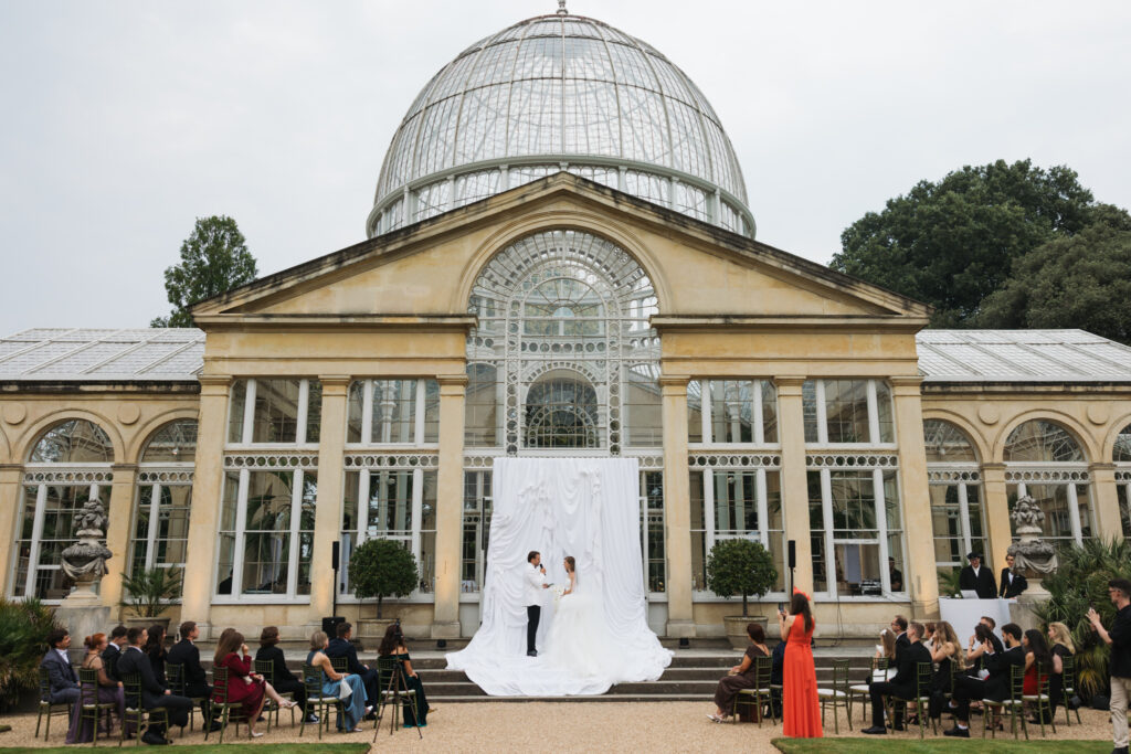 Editorial wedding photography of a young Gen Z fashion forward couple during their Russian luxury wedding at Syon Conservatory, London.
