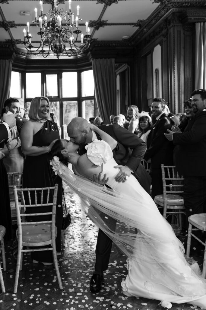 Manor by the Lake Wedding editorial photography kiss dip